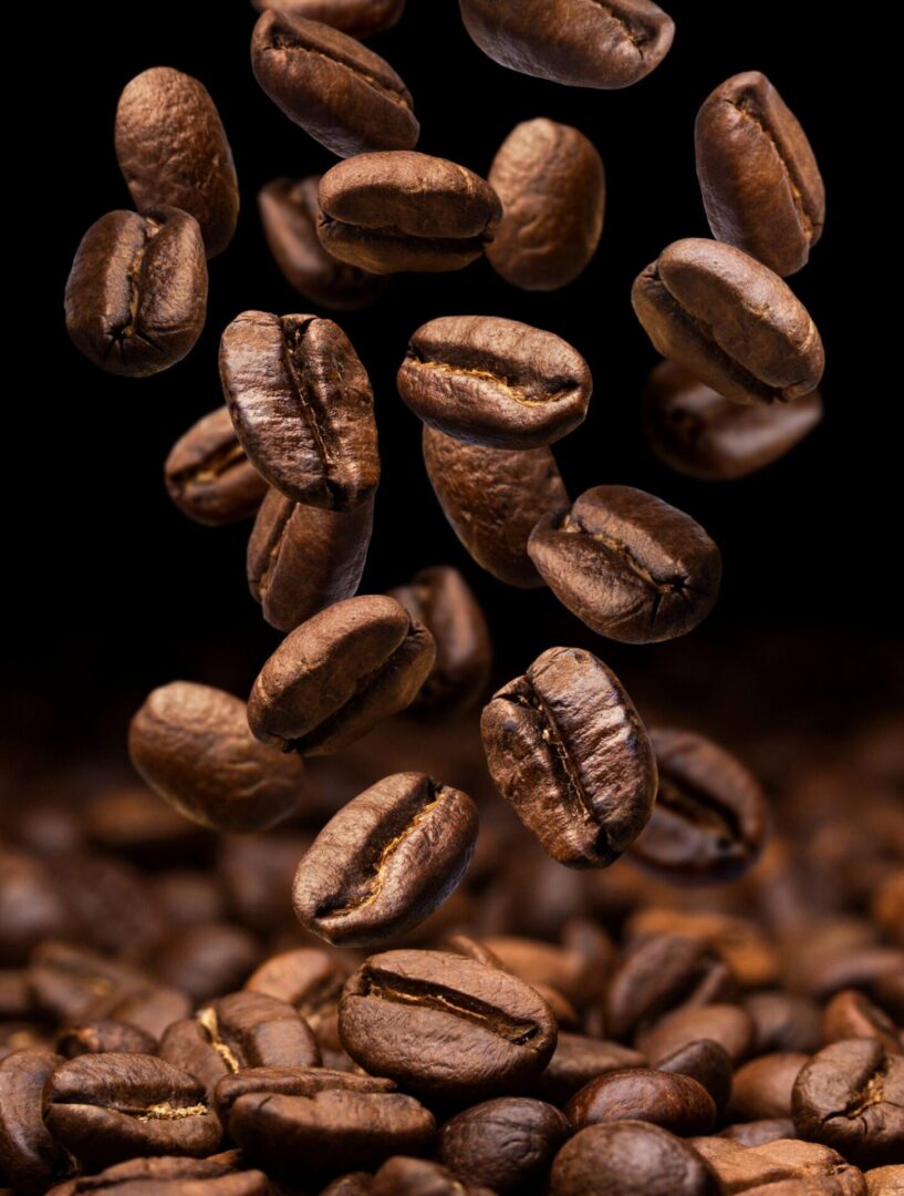 A bunch of coffee beans flying in the air