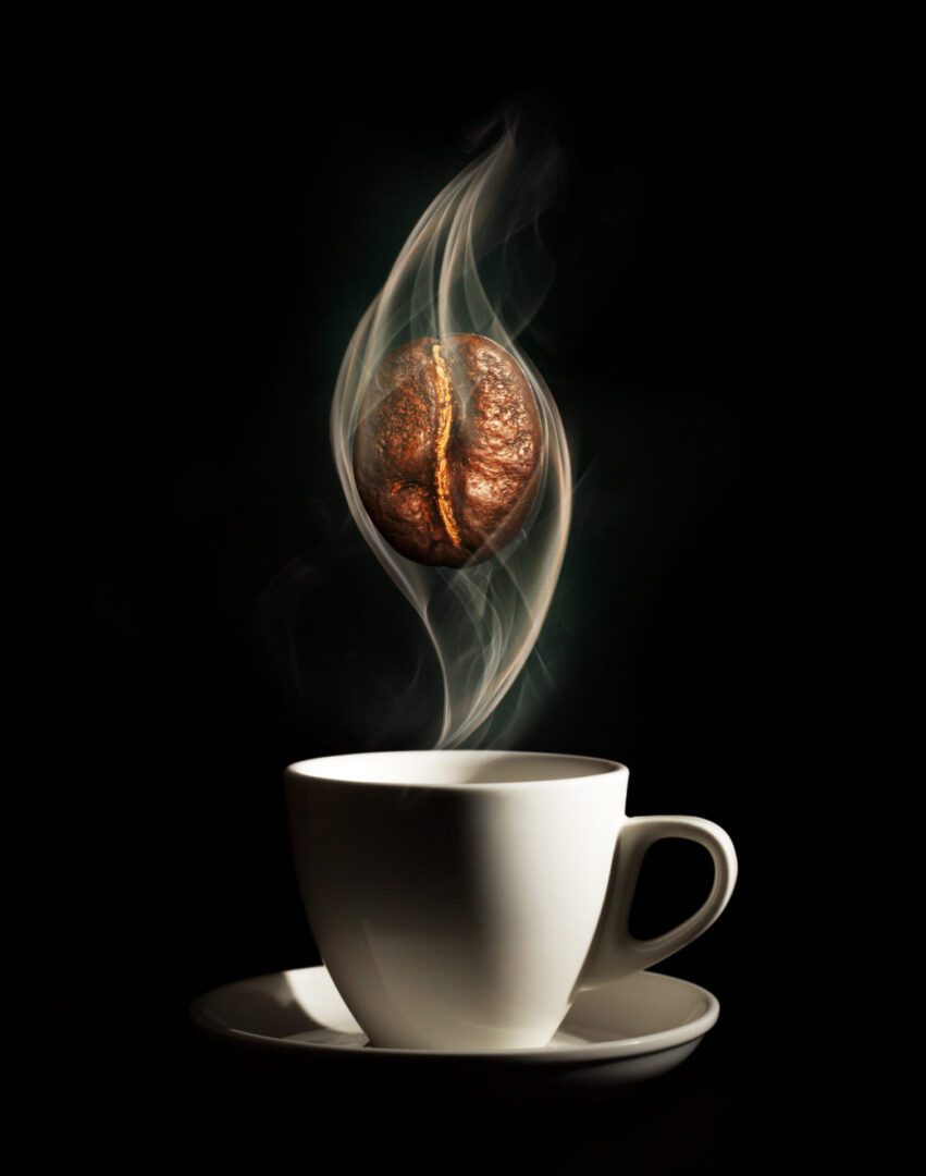 A cup of coffee with smoke coming out it.