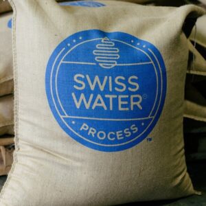 A bag of swiss water process is sitting on the floor.